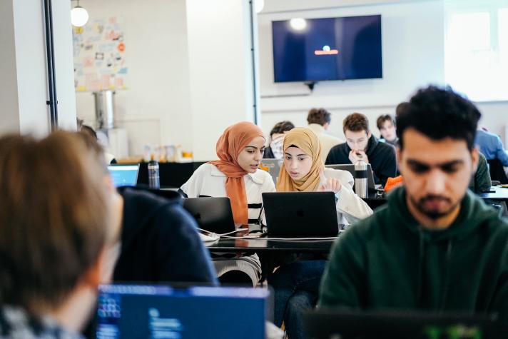 Hackathon participants discuss ideas among themselves