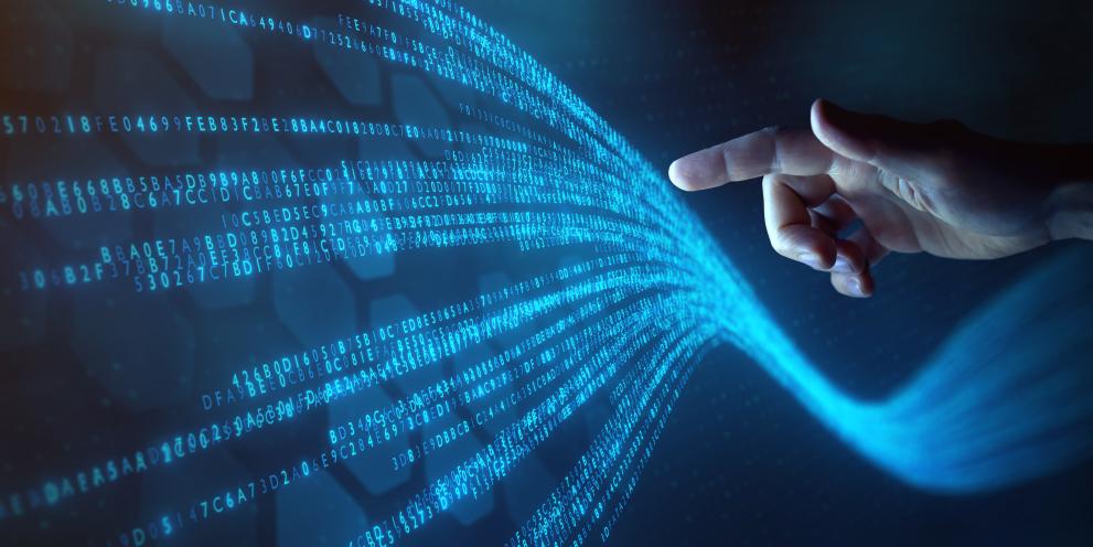 Human hand in contact with data