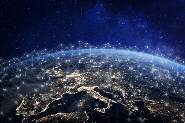 Map of Europe at night overlapped by a network representation
