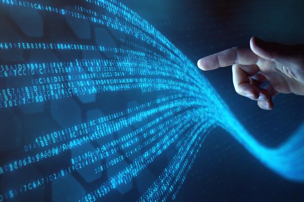 Human hand in contact with data